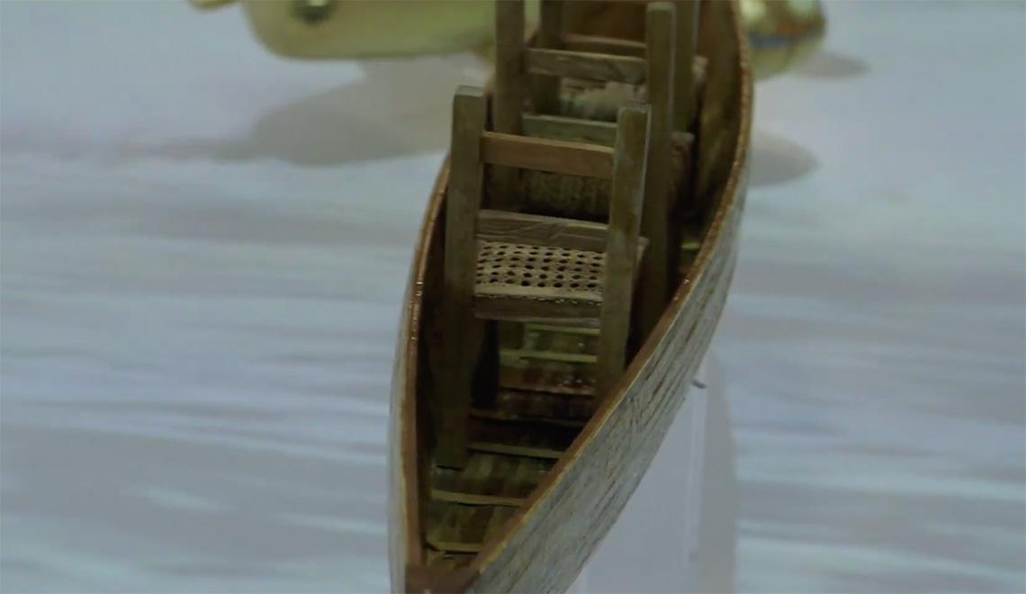 A wooden boat floats on water