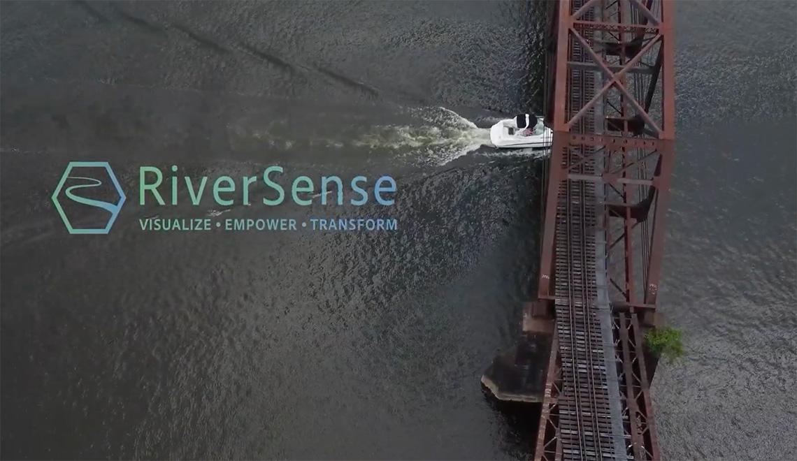 RiverSense title screen with image of boat and bridge on river